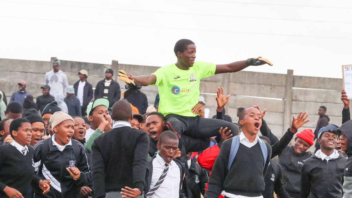Ntfonjeni High School pupils jubilantly hoist goalkeeper Boy Shongwe after his heroics helped secure a 2-0 victory over St John Bosco High School, booking their place in the InstaCash Schools Games final. (Pic: Sanele Jele)